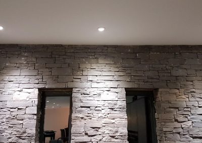 Downlighting a feature wall
